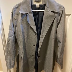 Knee length women’s blazer with belt.